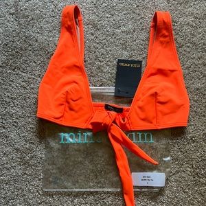Orange bikini top size small. New with tags. Never worn. Mint Swim.